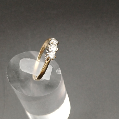 35 - Three Stone Diamond Ring set in 9 carat yellow gold.  
- weight 2g
- size O