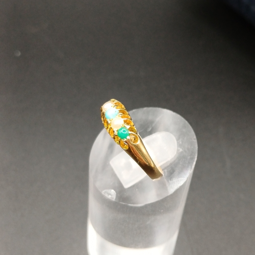 39 - Pretty Turquoise and Seed Pearl Ring set in 18 carat yellow gold.
- weight 2.61g
- size M / N