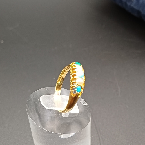 39 - Pretty Turquoise and Seed Pearl Ring set in 18 carat yellow gold.
- weight 2.61g
- size M / N