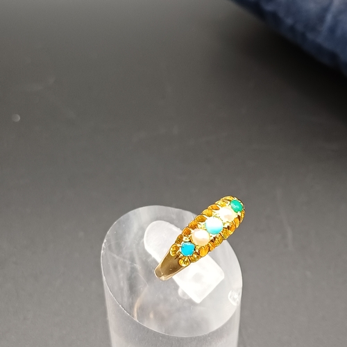 39 - Pretty Turquoise and Seed Pearl Ring set in 18 carat yellow gold.
- weight 2.61g
- size M / N