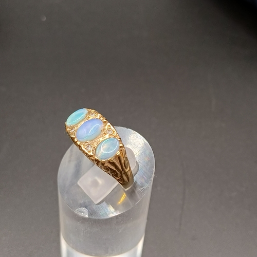 40 - Opal and Diamond Ring set in 9 carat yellow gold.
- weight 4.30g
- size L