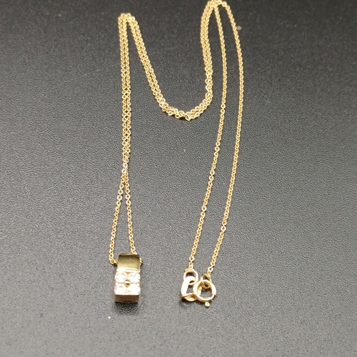 44 - Diamond Pendant and chain in 18 carat yellow gold weighing 2.2g