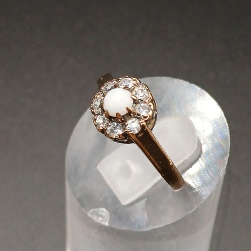 46 - Opal and White Stone Ring set in 9 carat yellow gold
- weight 2.2g
- size N / O