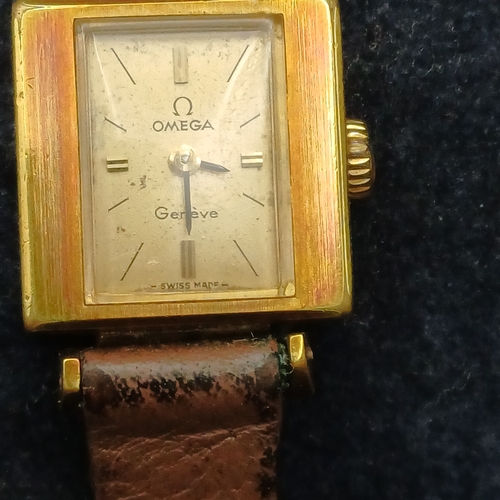52 - Vintage Omega Geneve Ladies Watch on a leather strap in working order and good condition for its age... 