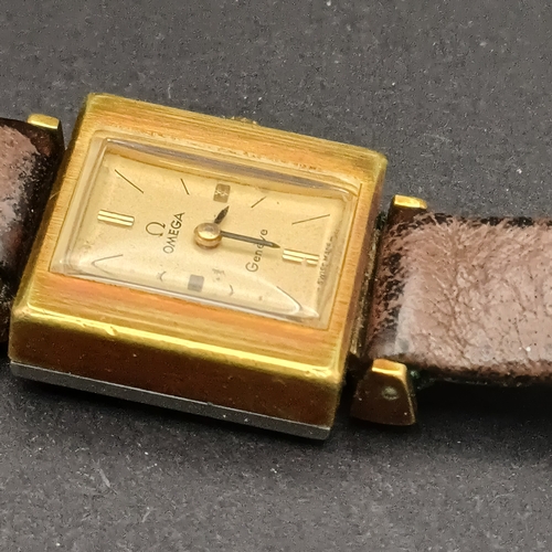 52 - Vintage Omega Geneve Ladies Watch on a leather strap in working order and good condition for its age... 