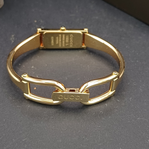 53 - Pair of Gucci Ladies Watches, both boxed with paperwork:
1.  Gucci 6800L - Silver Metal Face and Ban... 