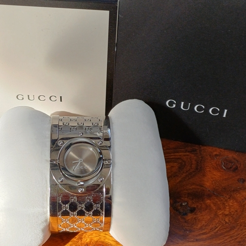 57 - Ladies Gucci Twirl Bangle Watch.  This is in excellent condition and all boxed with paperwork.