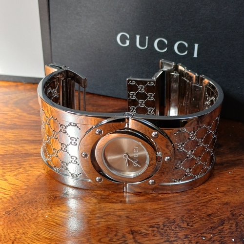 57 - Ladies Gucci Twirl Bangle Watch.  This is in excellent condition and all boxed with paperwork.