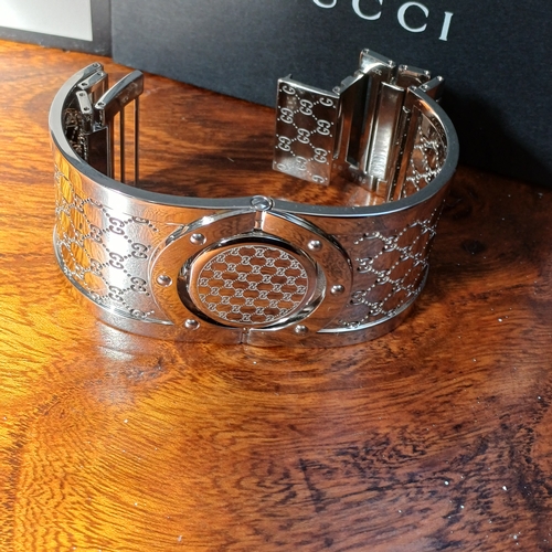 57 - Ladies Gucci Twirl Bangle Watch.  This is in excellent condition and all boxed with paperwork.