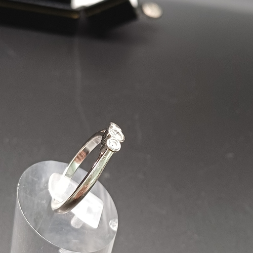 98 - Three Stone Diamond Ring set in Palladium
- weight 3.7g
- size N