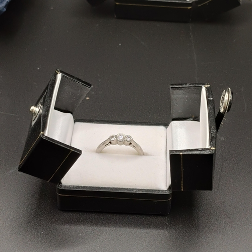 98 - Three Stone Diamond Ring set in Palladium
- weight 3.7g
- size N