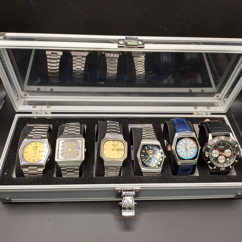 103 - Collection of Six Watches in storage case.  All watches are stainless steel cases and four have stai...