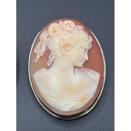6 - Two stunning cameo brooches on silver setting.
