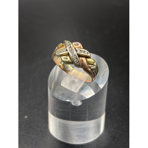 13 - 9ct yellow gold with diamond cluster in the style of a puzzle ring.
Size K / L: Weight 4.6g