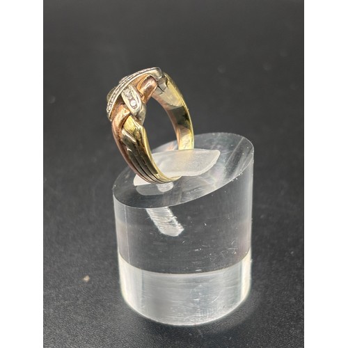 13 - 9ct yellow gold with diamond cluster in the style of a puzzle ring.
Size K / L: Weight 4.6g