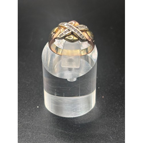 13 - 9ct yellow gold with diamond cluster in the style of a puzzle ring.
Size K / L: Weight 4.6g
