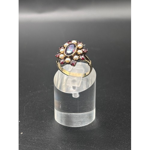 14 - This beautiful 8ct yellow gold, garnet and seed pearl ring size P/Q. Believed to be German or Austri... 