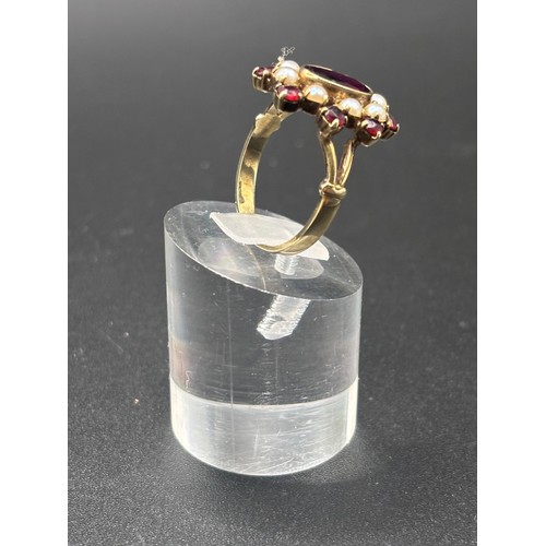 14 - This beautiful 8ct yellow gold, garnet and seed pearl ring size P/Q. Believed to be German or Austri... 