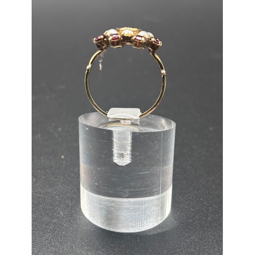 14 - This beautiful 8ct yellow gold, garnet and seed pearl ring size P/Q. Believed to be German or Austri... 