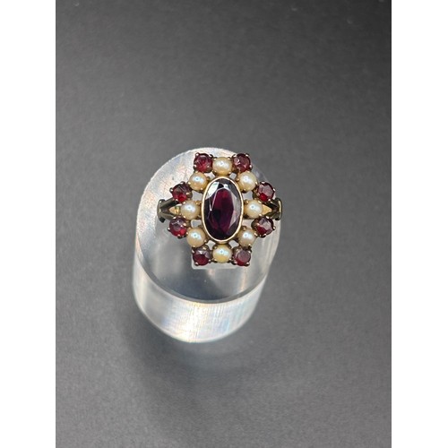 14 - This beautiful 8ct yellow gold, garnet and seed pearl ring size P/Q. Believed to be German or Austri... 