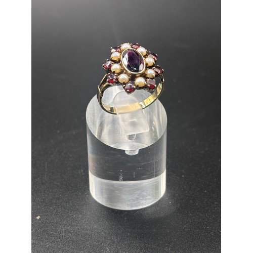 14 - This beautiful 8ct yellow gold, garnet and seed pearl ring size P/Q. Believed to be German or Austri... 