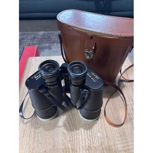 82 - This item is a pair of vintage Hyoh Tokyo 12x50 binoculars, featuring coated optics and a field of v... 
