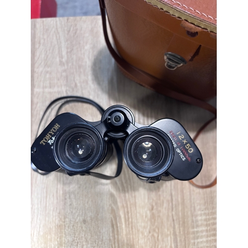 82 - This item is a pair of vintage Hyoh Tokyo 12x50 binoculars, featuring coated optics and a field of v... 