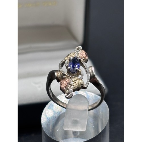 27 - Black Hills Gold ring, crafted in silver with signiture tri gold  leaf motifs, 10k yellow gold and r... 