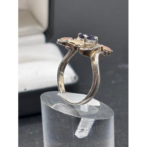 27 - Black Hills Gold ring, crafted in silver with signiture tri gold  leaf motifs, 10k yellow gold and r... 