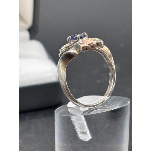 27 - Black Hills Gold ring, crafted in silver with signiture tri gold  leaf motifs, 10k yellow gold and r... 