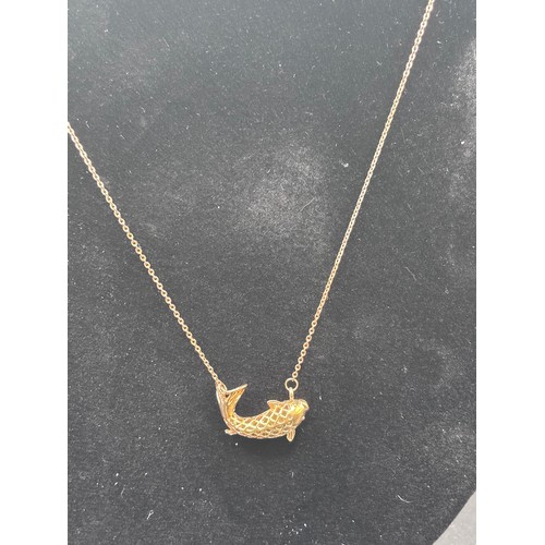 28 - Stunning Piece of Cartier in the design of a Koi fish. In 14 carat gold weighing 7g.