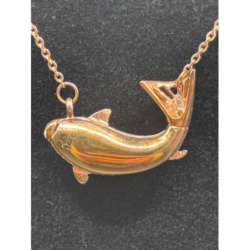 28 - Stunning Piece of Cartier in the design of a Koi fish. In 14 carat gold weighing 7g.