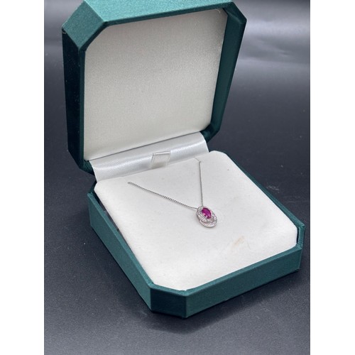 29 - White 9ct gold necklace and ruby pendant.
Weight 2.5g