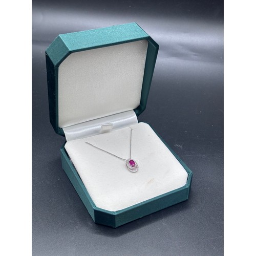 29 - White 9ct gold necklace and ruby pendant.
Weight 2.5g