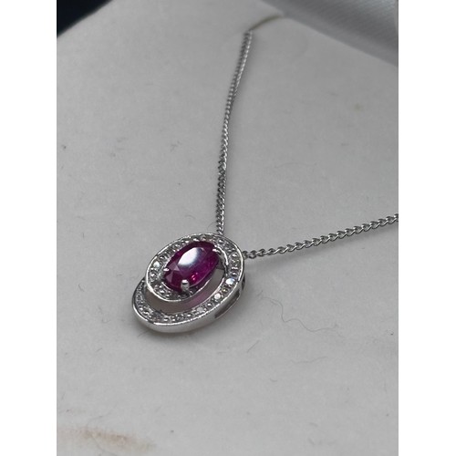 29 - White 9ct gold necklace and ruby pendant.
Weight 2.5g