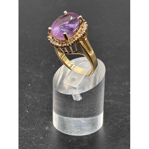 30 - Stunning 18ct yellow gold ring with huge Amethyst and diamond setting. Size R/S weighs 11g