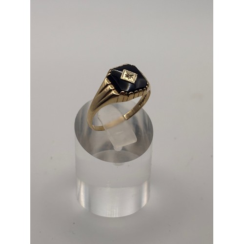 32 - 9ct yellow gold  Black Onyx and diamond signet ring.
weighs 2.54g 
Size u/v
size  u/ v