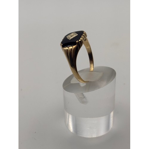 32 - 9ct yellow gold  Black Onyx and diamond signet ring.
weighs 2.54g 
Size u/v
size  u/ v