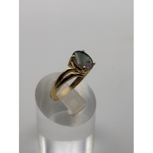 36 - 14ct yellow gold ring with natural ammolite gemstone.
Weigh 3.22g
P/q