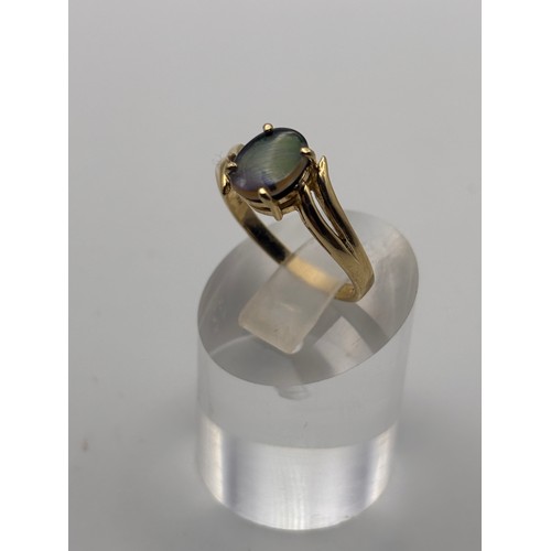 36 - 14ct yellow gold ring with natural ammolite gemstone.
Weigh 3.22g
P/q