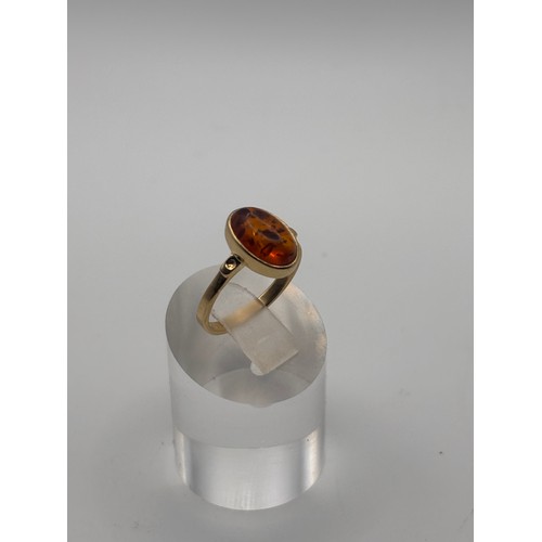 40 - Amber gemstone in 14ct gold setting.
weighs 4.34g
Size O