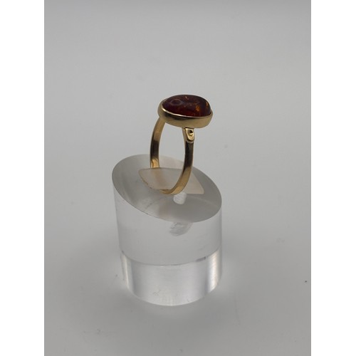 40 - Amber gemstone in 14ct gold setting.
weighs 4.34g
Size O