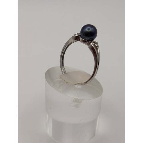 41 - Tahitian black pearl accented with diamonds set in 9ct white gold setting and weighs 1.86g
Size n/o