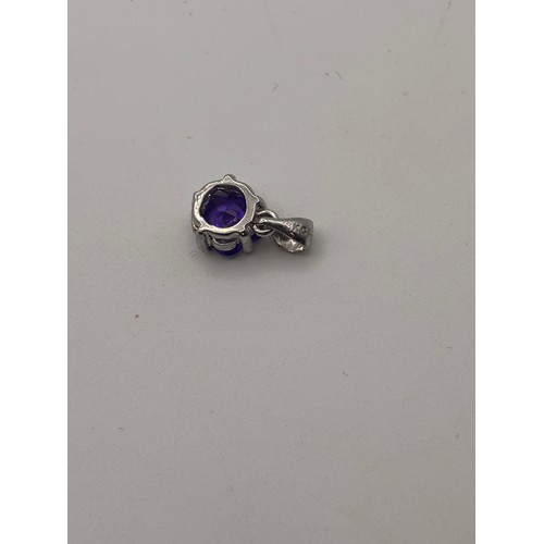 45 - 18ct white gold pendant with amesthyst gemstone.
