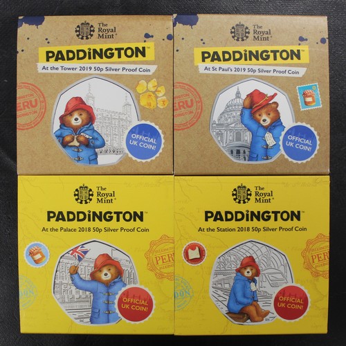 147 - Silver proof Paddington Bear 50p's. A full set of four (Tower, St Pauls, Palace and Station). As str... 