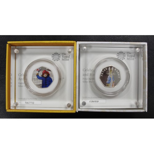 148 - Silver Proofs 50p's (2) comprising Paddington Bear At the Palace & 2019 Peter Rabbit. Boxed &... 