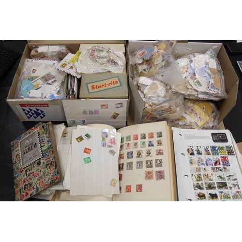 292 - A large collection of world stamps in 2 boxes and 2 folders. including philatelic price guide. The a... 