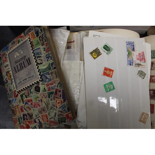 292 - A large collection of world stamps in 2 boxes and 2 folders. including philatelic price guide. The a... 