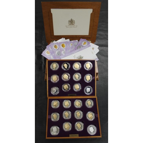 133 - 2002 Golden Jubilee silver proof coin collection comprising 24 crown sized issues mostly gold accent... 