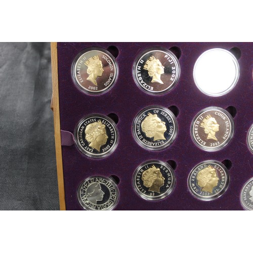 133 - 2002 Golden Jubilee silver proof coin collection comprising 24 crown sized issues mostly gold accent... 